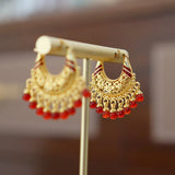 'GUID' Golden earrings with a red bead